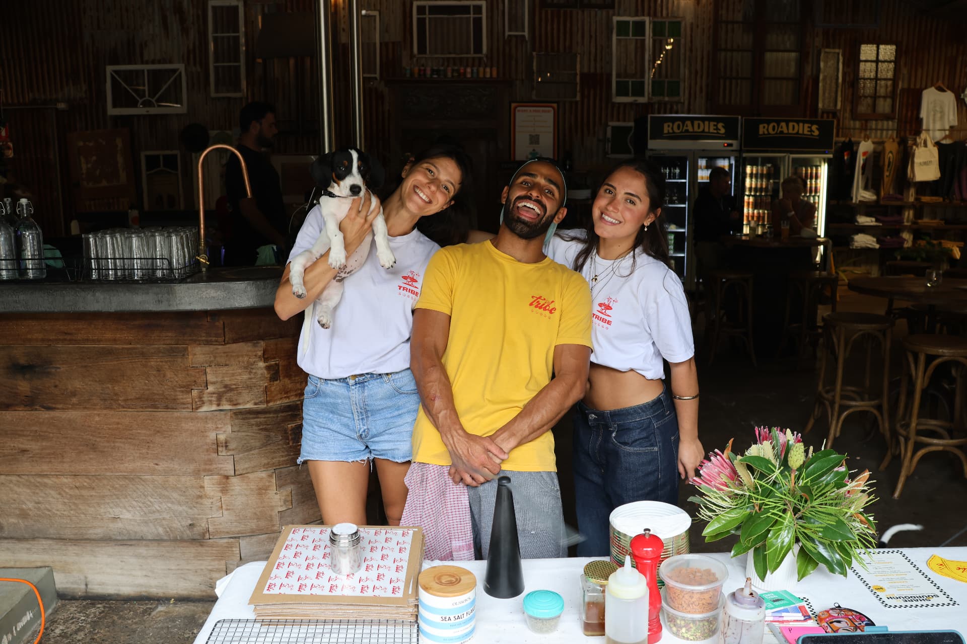 The Tribe Pizza crew serving fresh sourdough pizza at an event